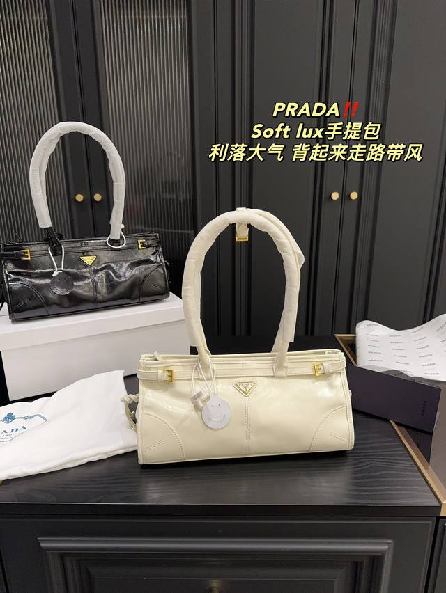 配盒尺寸32.15 普拉达prada Soft Lux手提包 质感很高级 容量超级大也很耐用 日常出街背它回头率百分百 就是这种随性慵懒感