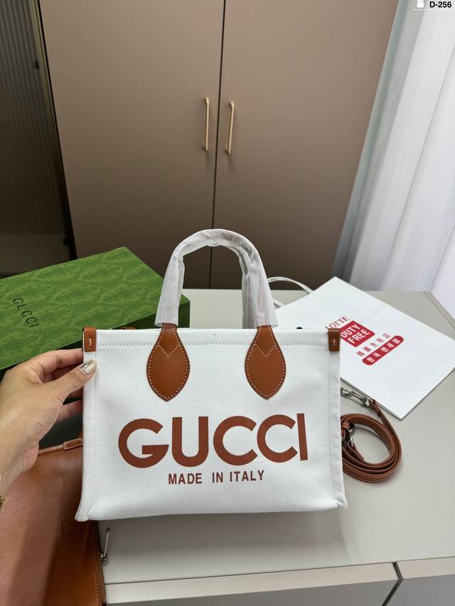 酷奇gucci 帆布托特包 质感很高级 容量超级大也很耐用 日常出街背它回头率百分百 就是这种随性慵懒感 D-256尺寸27.12.20折叠盒